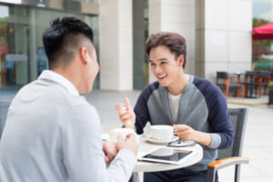 two persons talking
